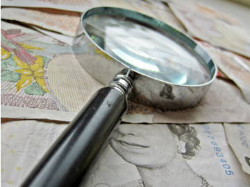 magnifying glass money