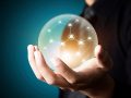 Business people holding social network in crystal ball